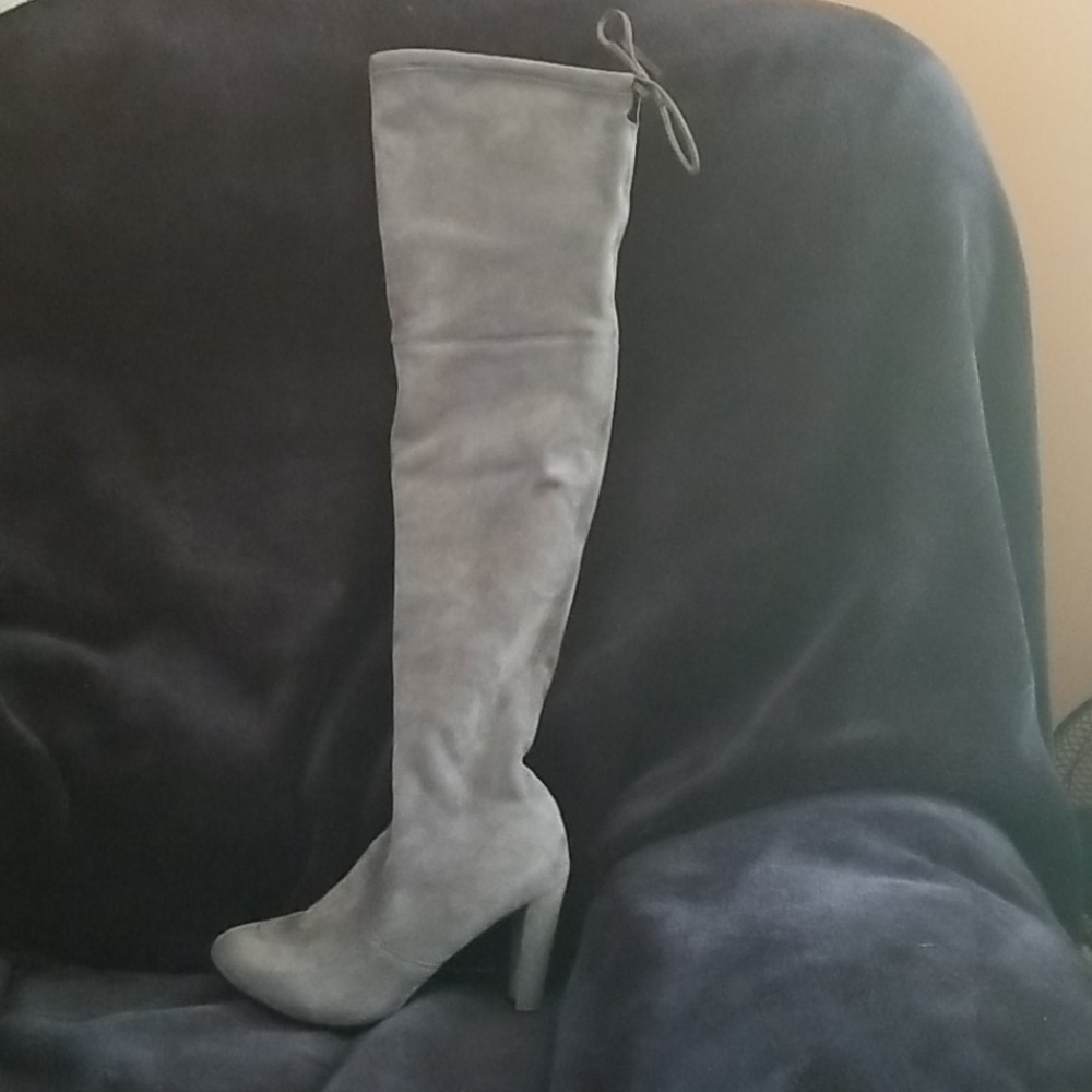 Thigh high sheep skin boots. Never worn. Size